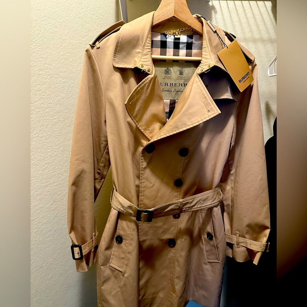 Burberry Women’s Sandringham Trench Coat, Mid-Length in color Honey.